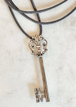 Load image into Gallery viewer, Antique Karen Lindner Designs French Silver Key Necklace on Suede
