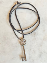 Load image into Gallery viewer, Antique Karen Lindner Designs French Silver Key Necklace on Suede
